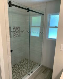 Frameless Houston sliding shower doors with barn door hardware