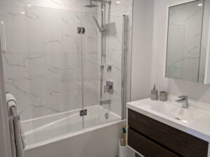 Glass shower doors for tub/shower combo alcove