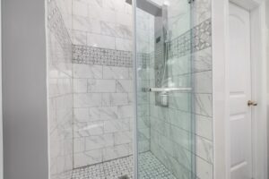 Houston sliding shower doors with towel bar in luxury bathroom